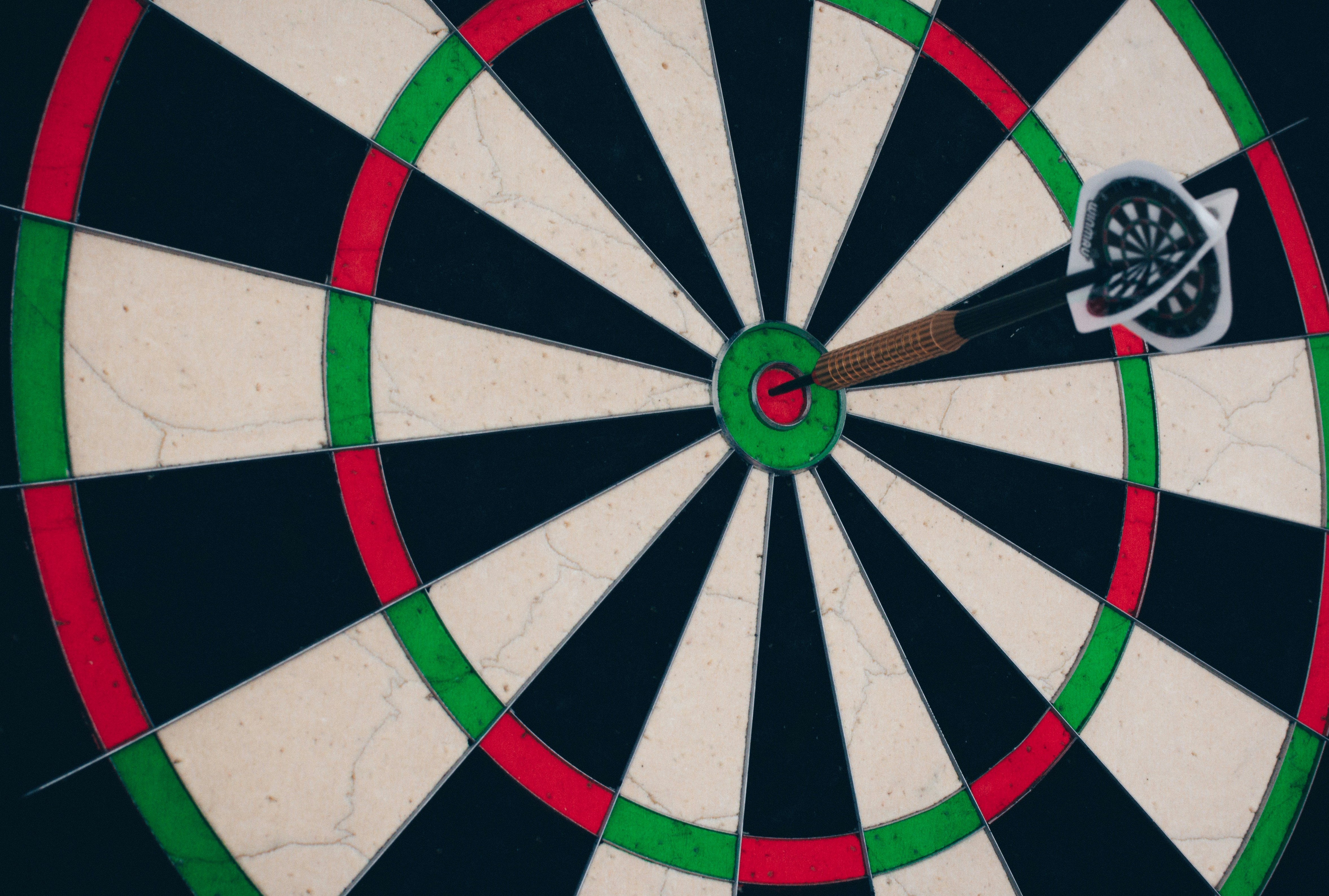 this image shows a dart with a bullseye pin to represent target