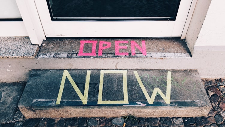 Door step with an "Open Now" sign made with a paining tape