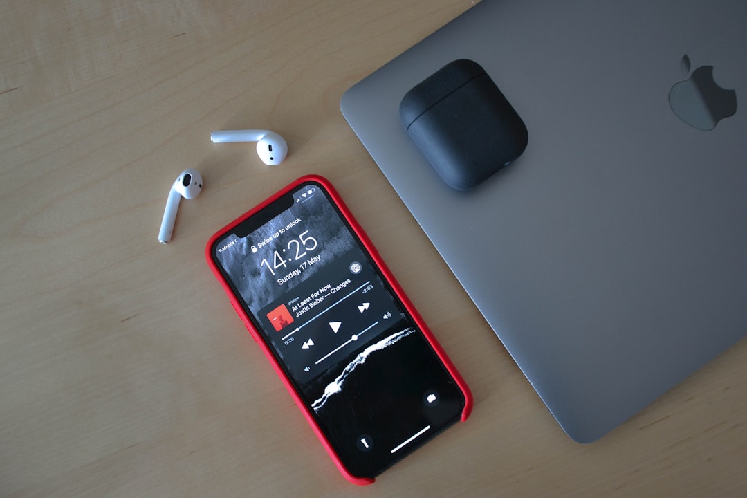 black iphone 5 on white table,
