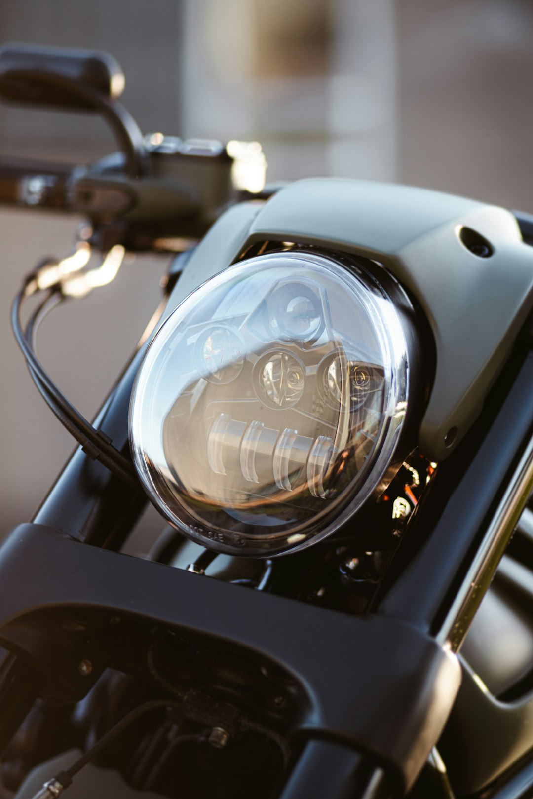 black and silver motorcycle headlight