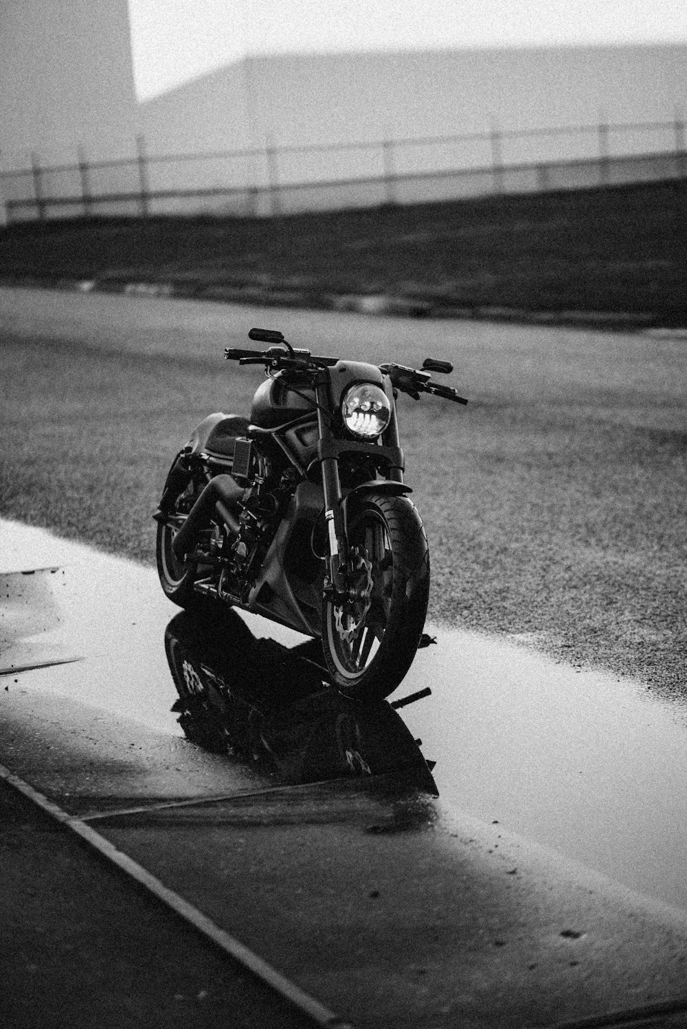 grayscale photo of black sports bike on road