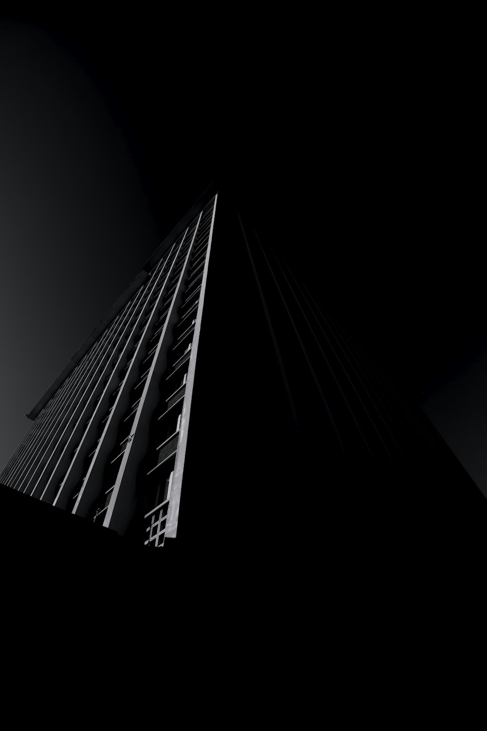 grayscale photo of high rise building