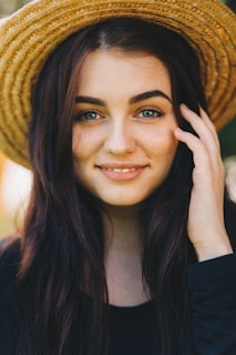 woman in brown sun hat