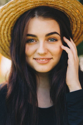 woman in brown sun hat
