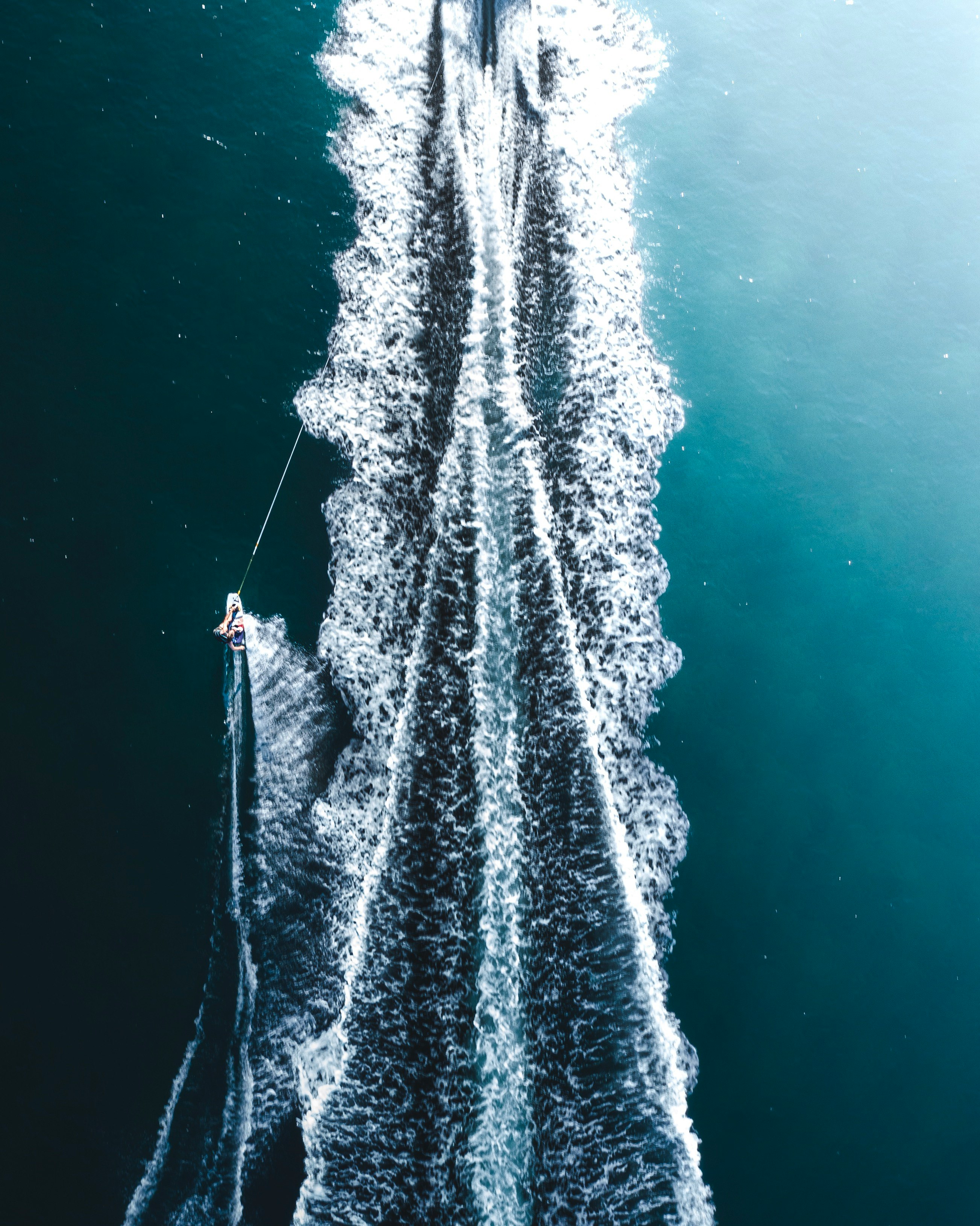 white and black boat on body of water