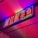 A vibrant, neon sign with red characters outlined by blue and green lights. It is mounted on a wall and the lighting creates a colorful glow on the surrounding area.