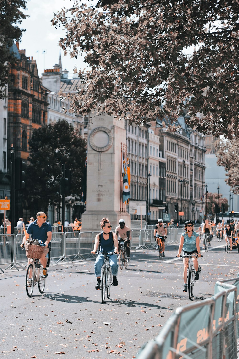 people riding bicycle on street during daytime