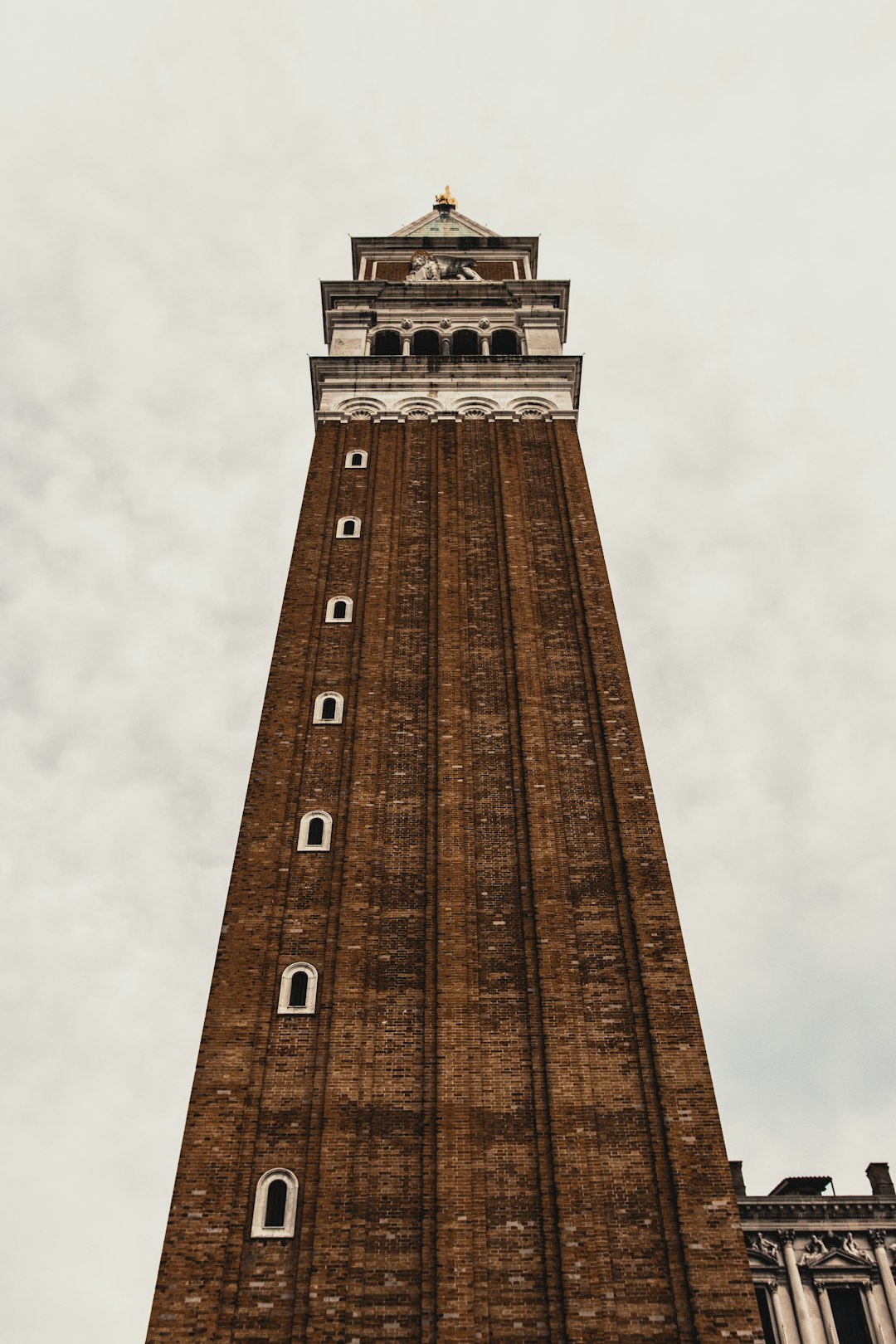 brown concrete tower under white sky during daytime