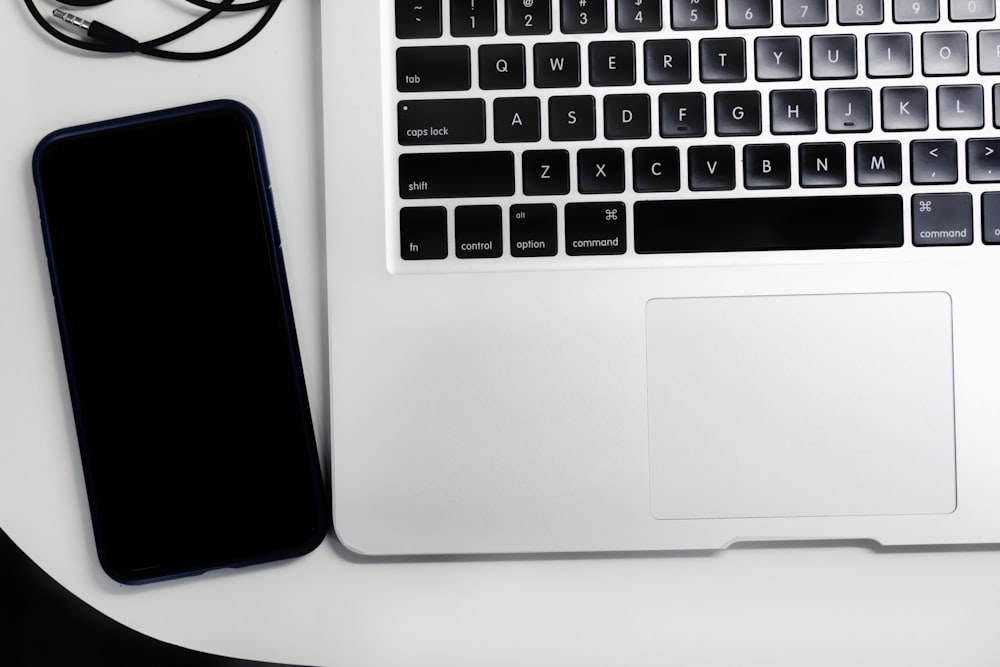 macbook pro on white table