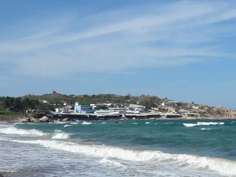 white and blue sky over beach