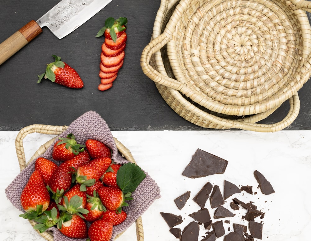 strawberries on brown woven basket