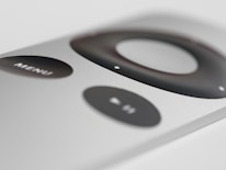 Close-up of a sleek smartphone displaying a simple remote control interface.