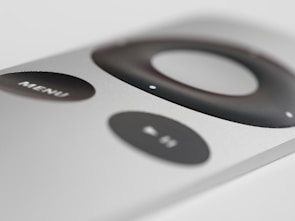 Close-up of a stylish air conditioner remote control with minimalist design