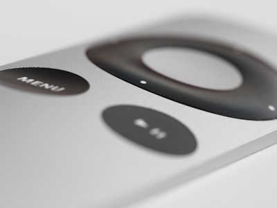 Close-up of a sleek smartphone displaying a simple remote control interface.