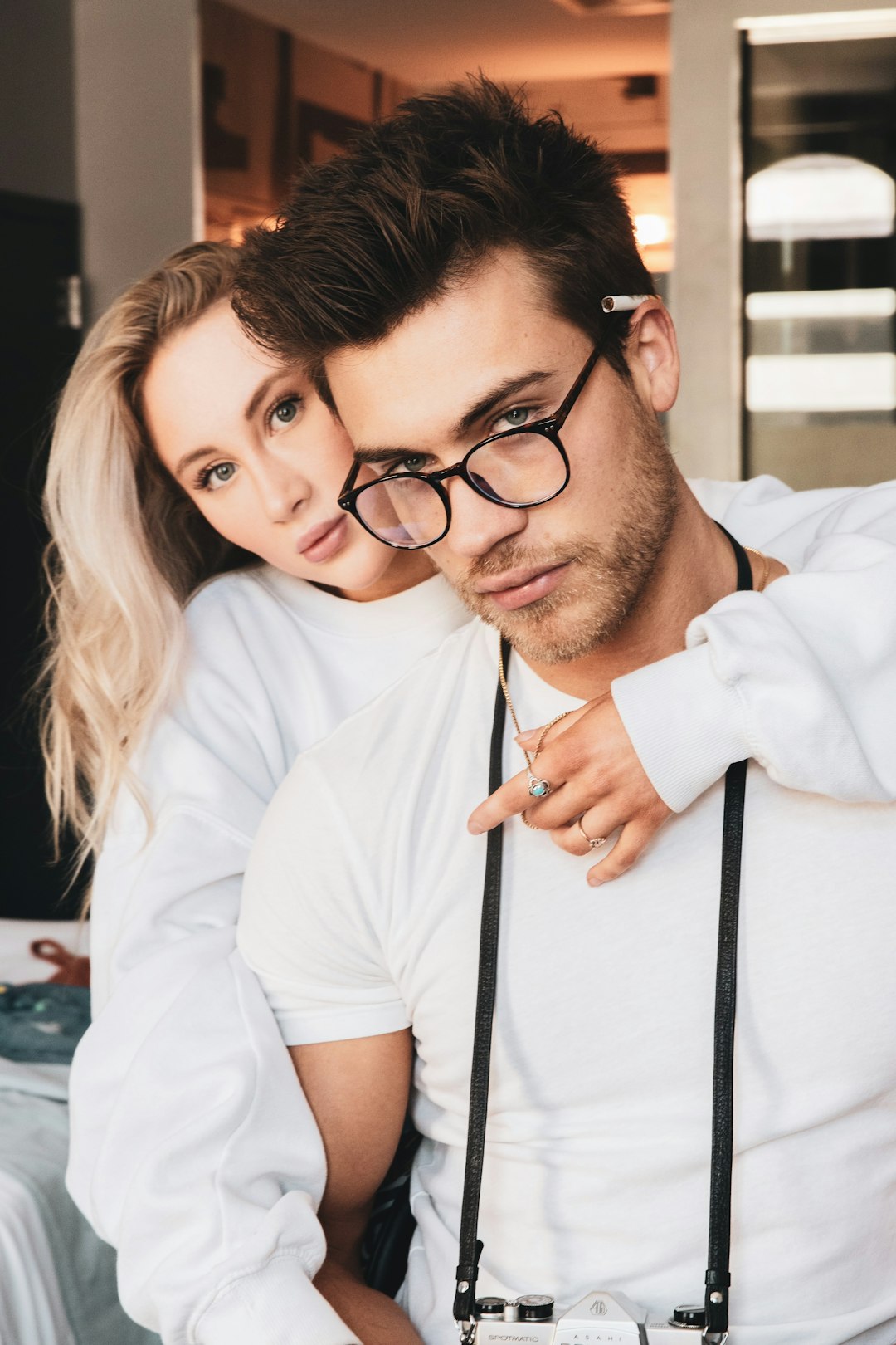 woman in white dress shirt wearing black framed eyeglasses