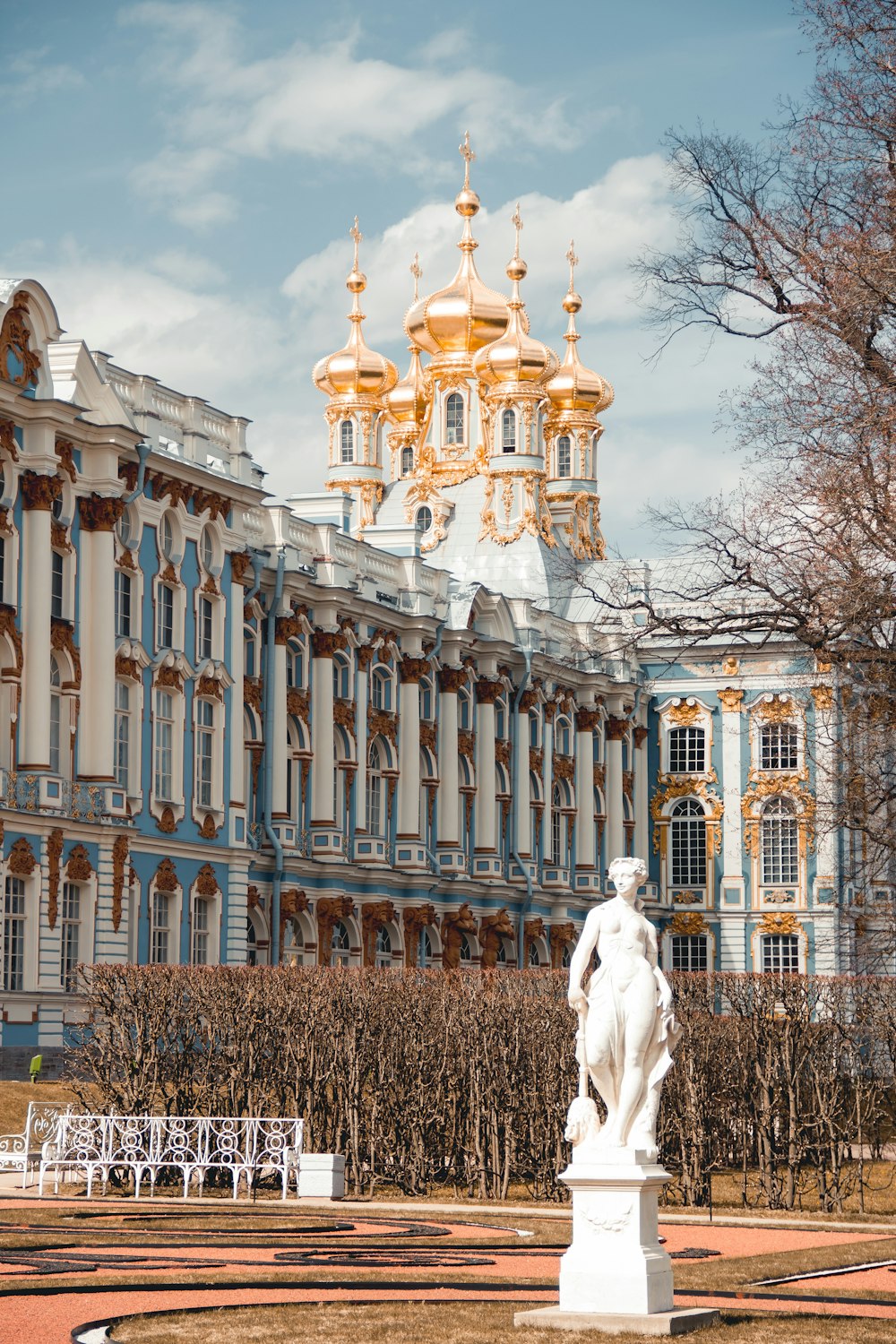 white horse statue near white concrete building during daytime