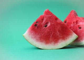 sliced watermelon on green surface