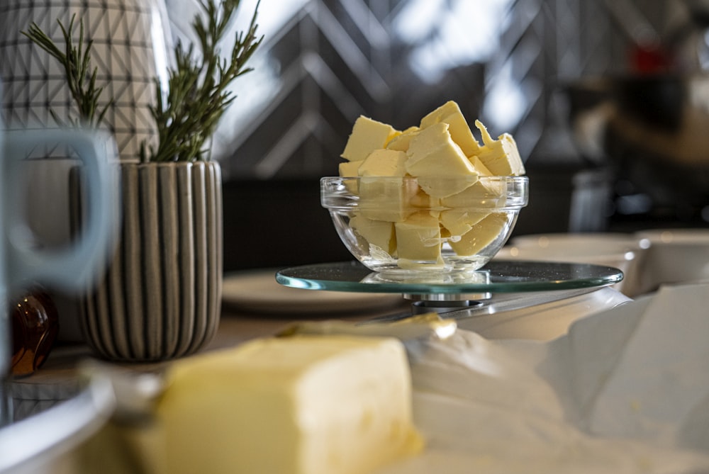 yellow cheese on green and white ceramic plate