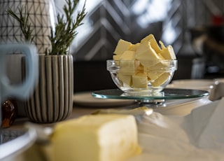 yellow cheese on green and white ceramic plate