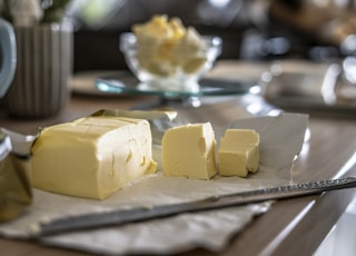 sliced cheese on clear glass plate