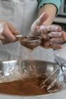 person holding silver round bowl