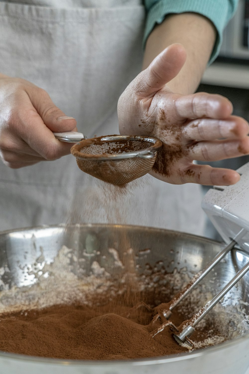 person holding silver round bowl