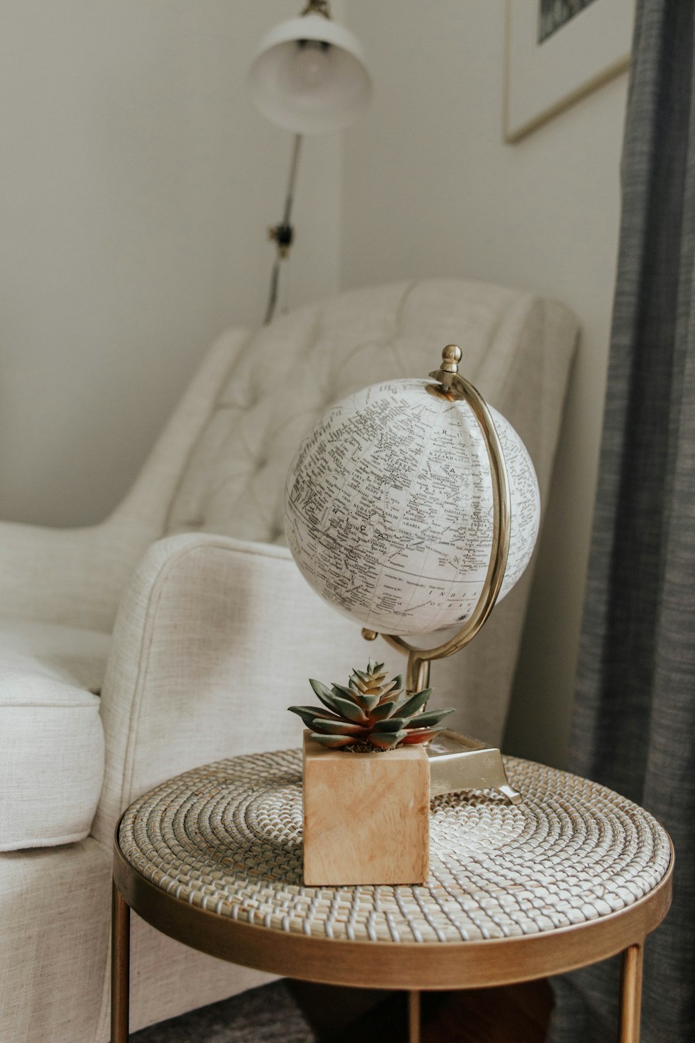 white and gold floral table lamp on white and brown table cloth