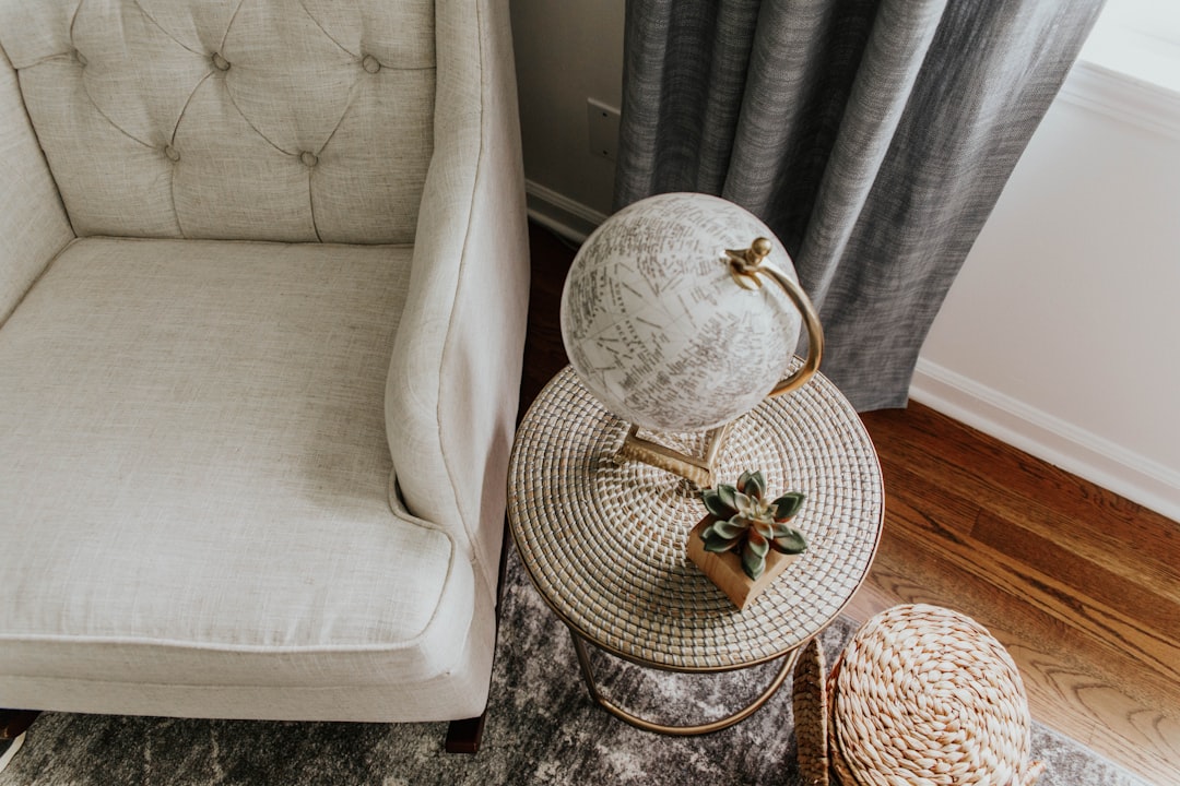 white and gray round table lamp on brown wooden table