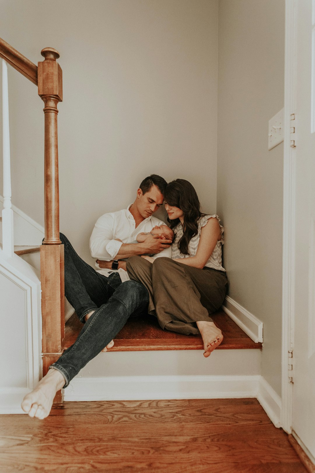 man and woman sitting on stairs