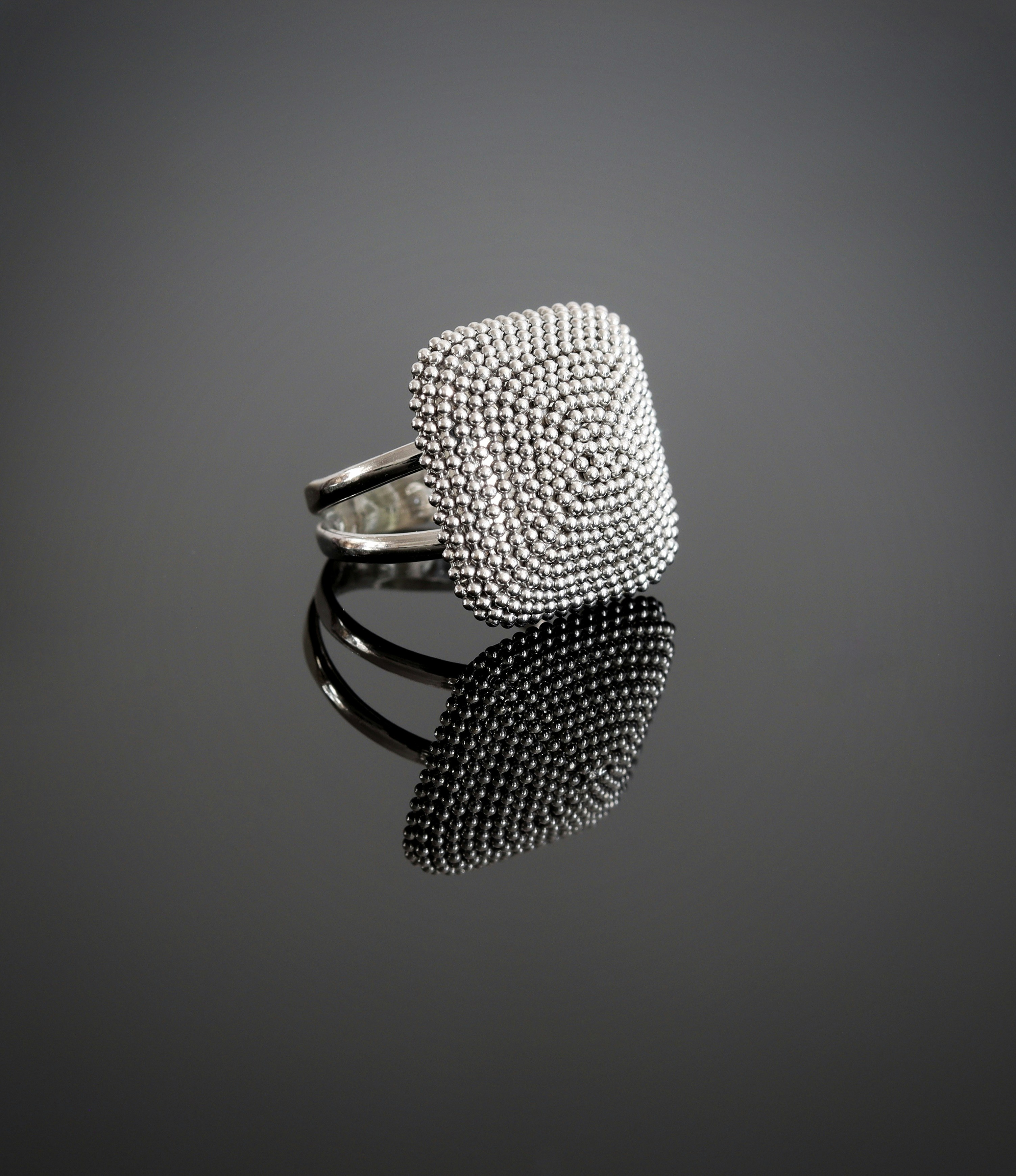 silver and black microphone on white surface