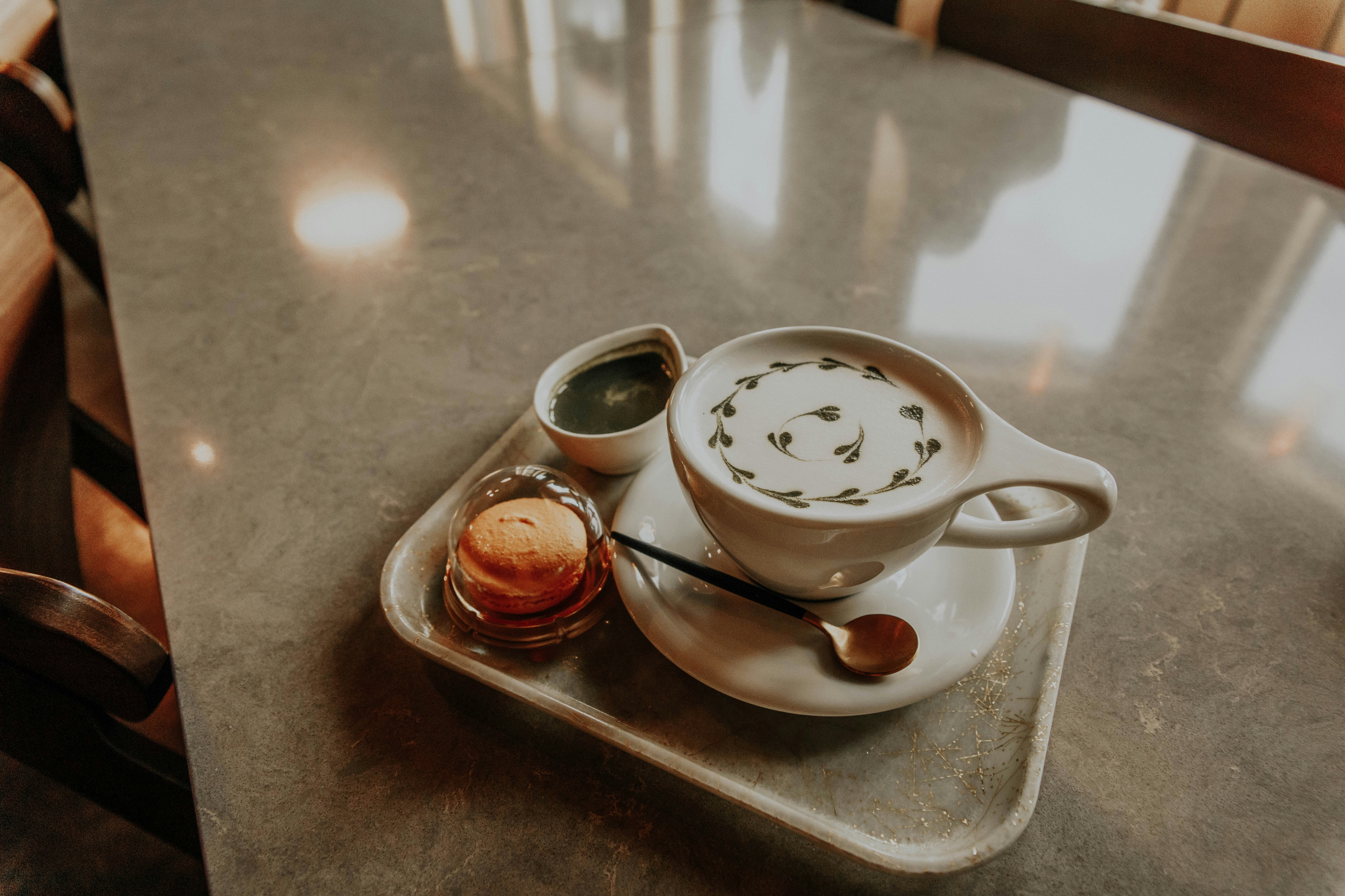 white ceramic teacup on saucer