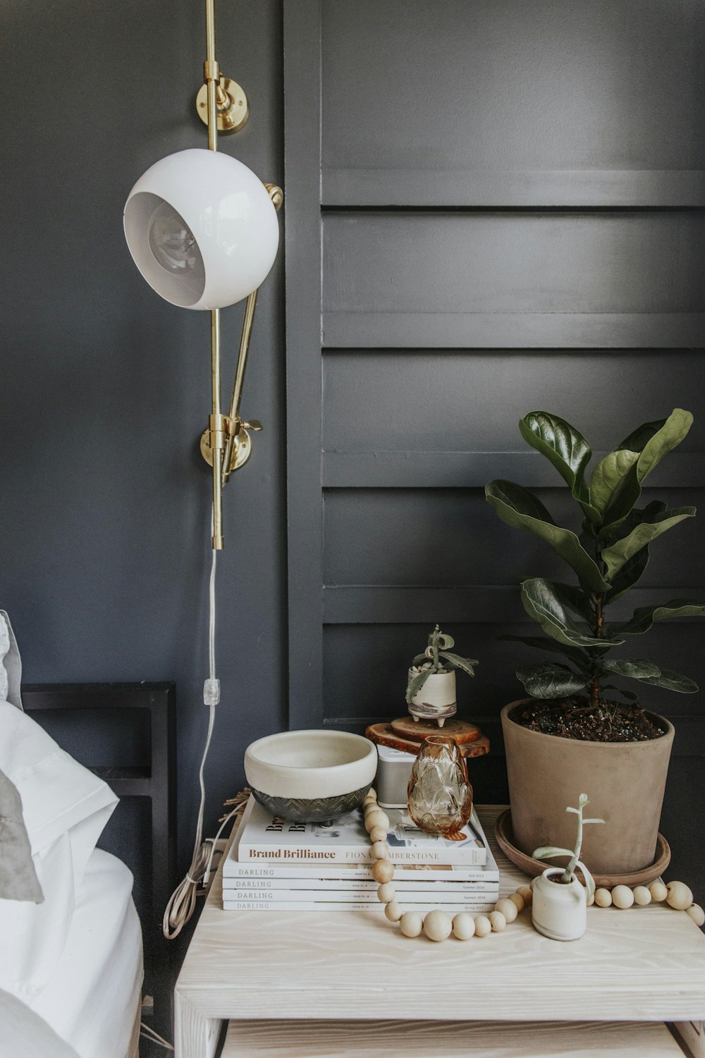 white and brown ceramic teacup on saucer beside white and brown ceramic saucer on table