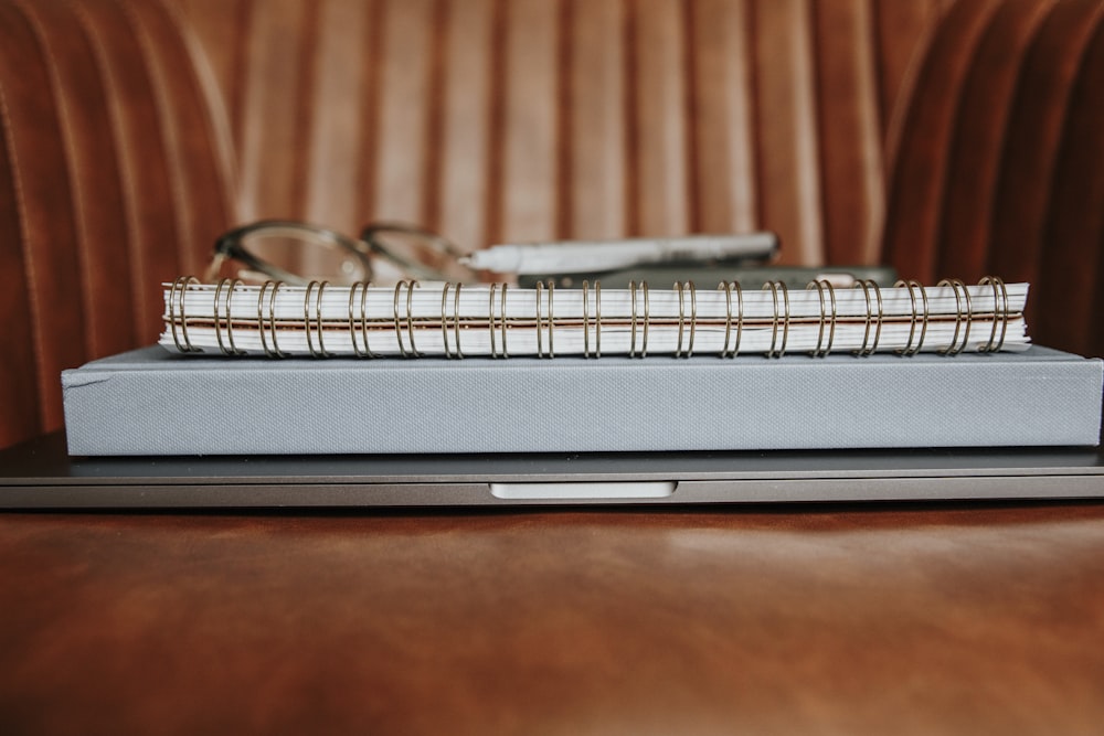 black and silver laptop computer on brown wooden table