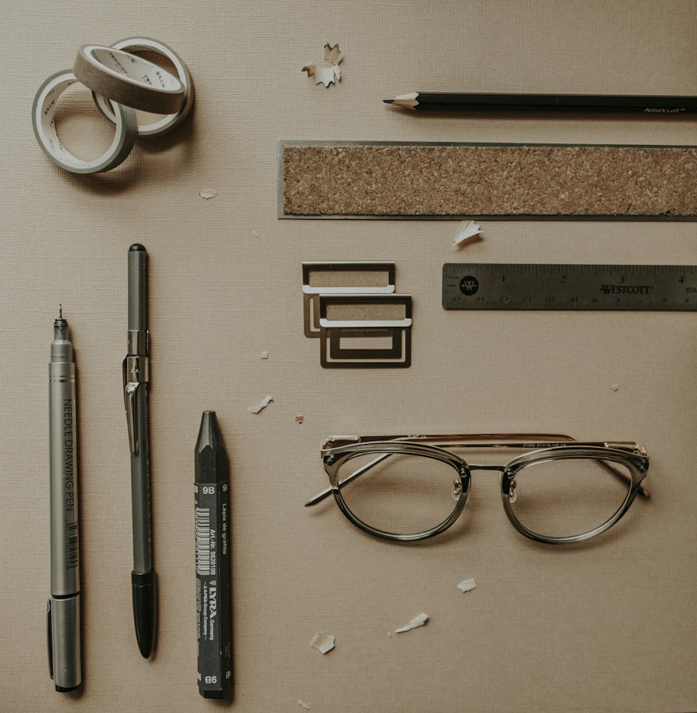 black click pen on brown wooden table