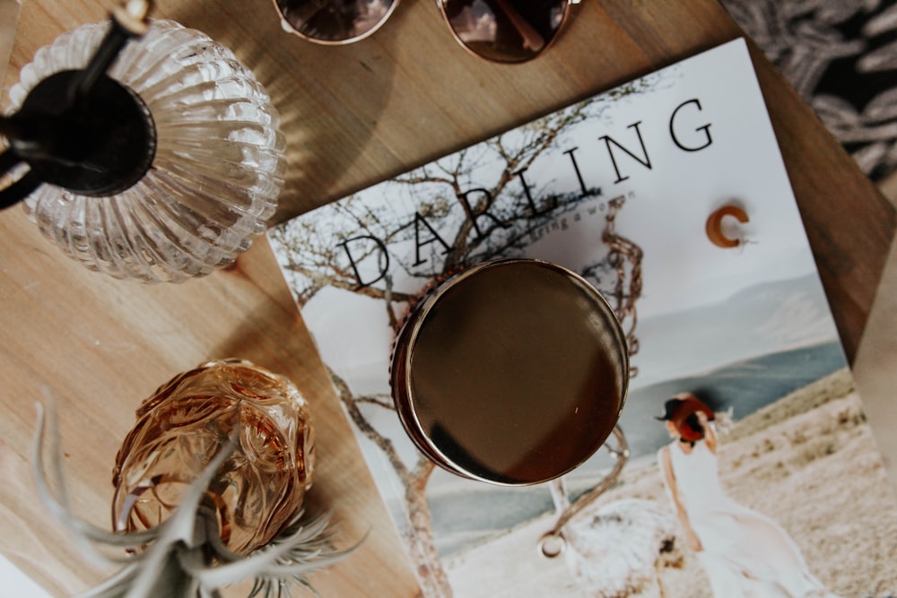 brown liquid in clear glass mug