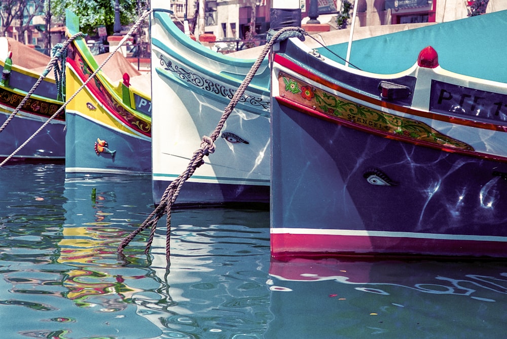 red and brown boat on water