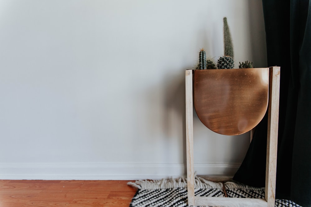 brown wooden chair on gray and black area rug