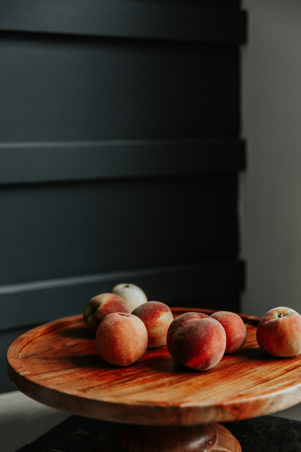 red apples on brown wooden round table