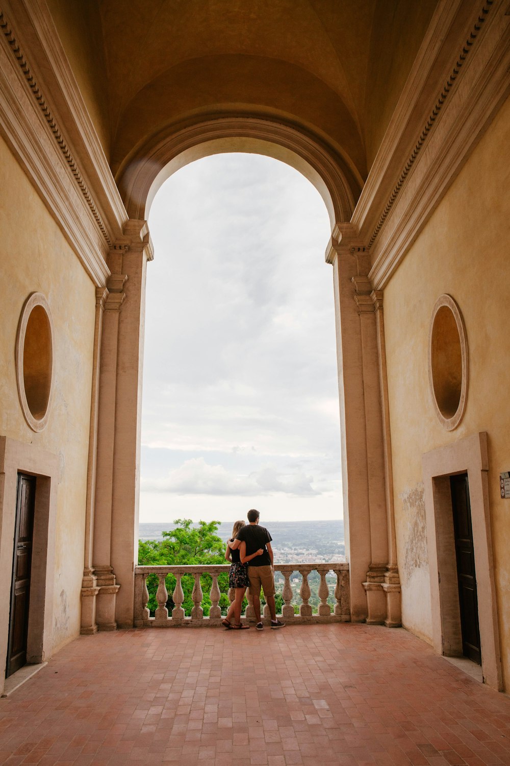 people standing on balcony during daytime