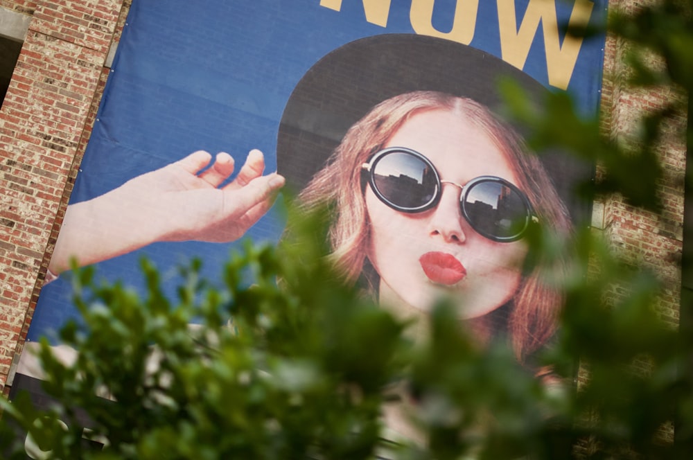 woman in red framed sunglasses