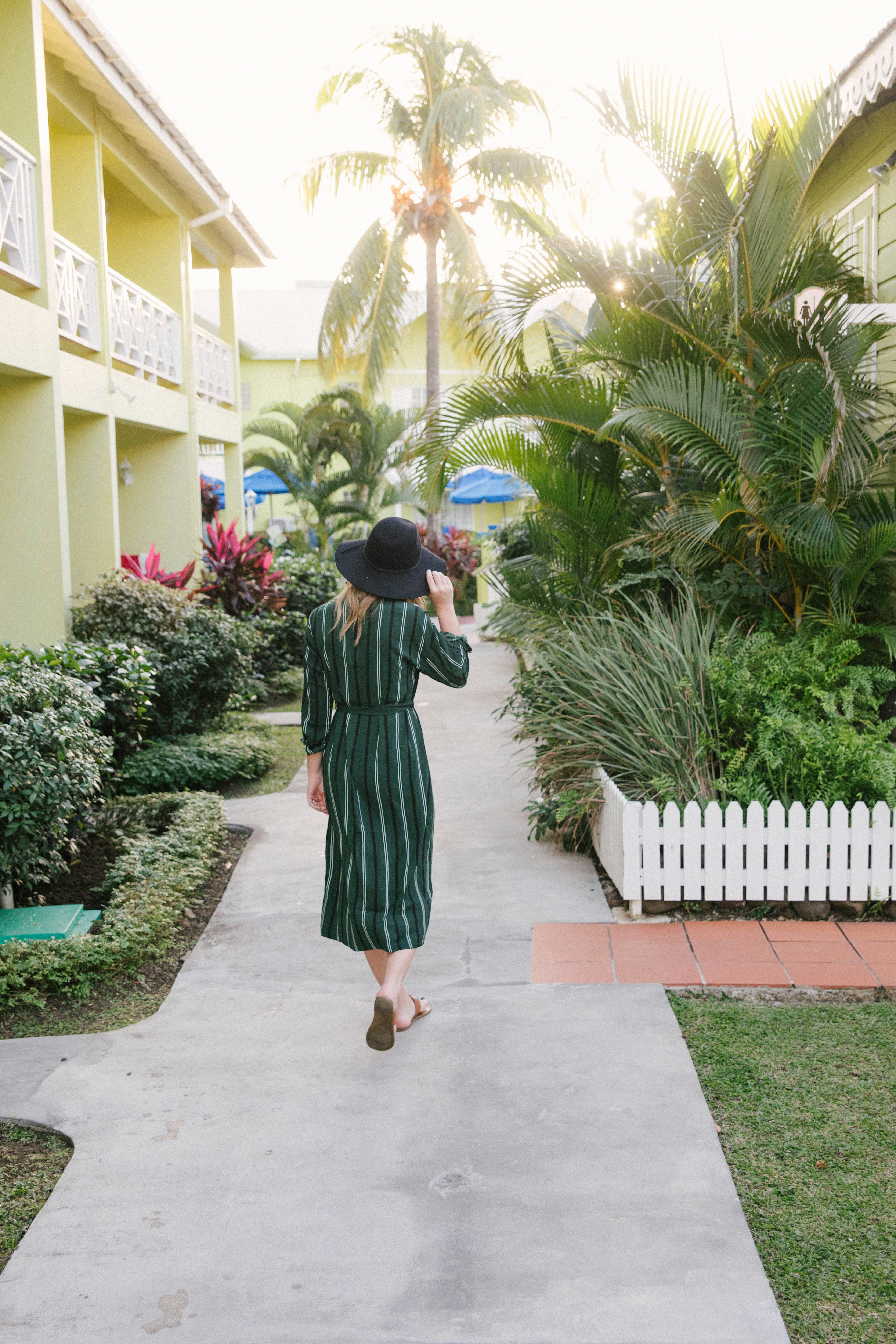boy in black and red dress holding blue ball
