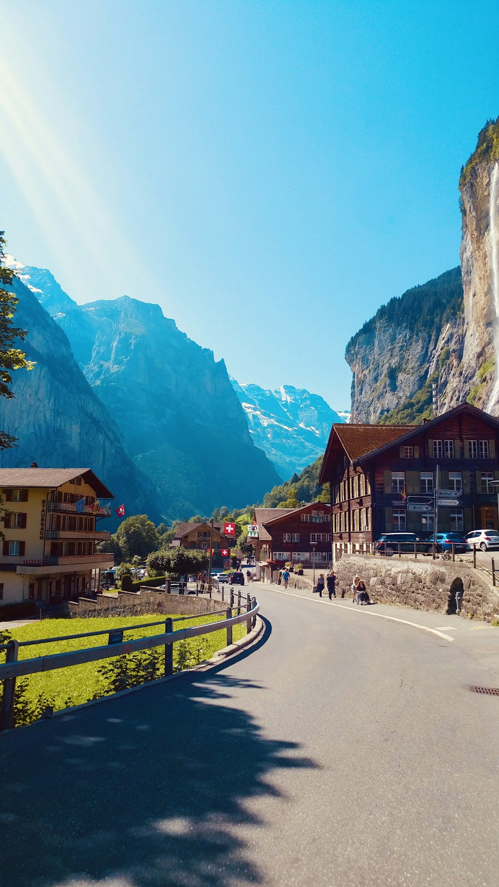 brown wooden houses near mountain during daytime