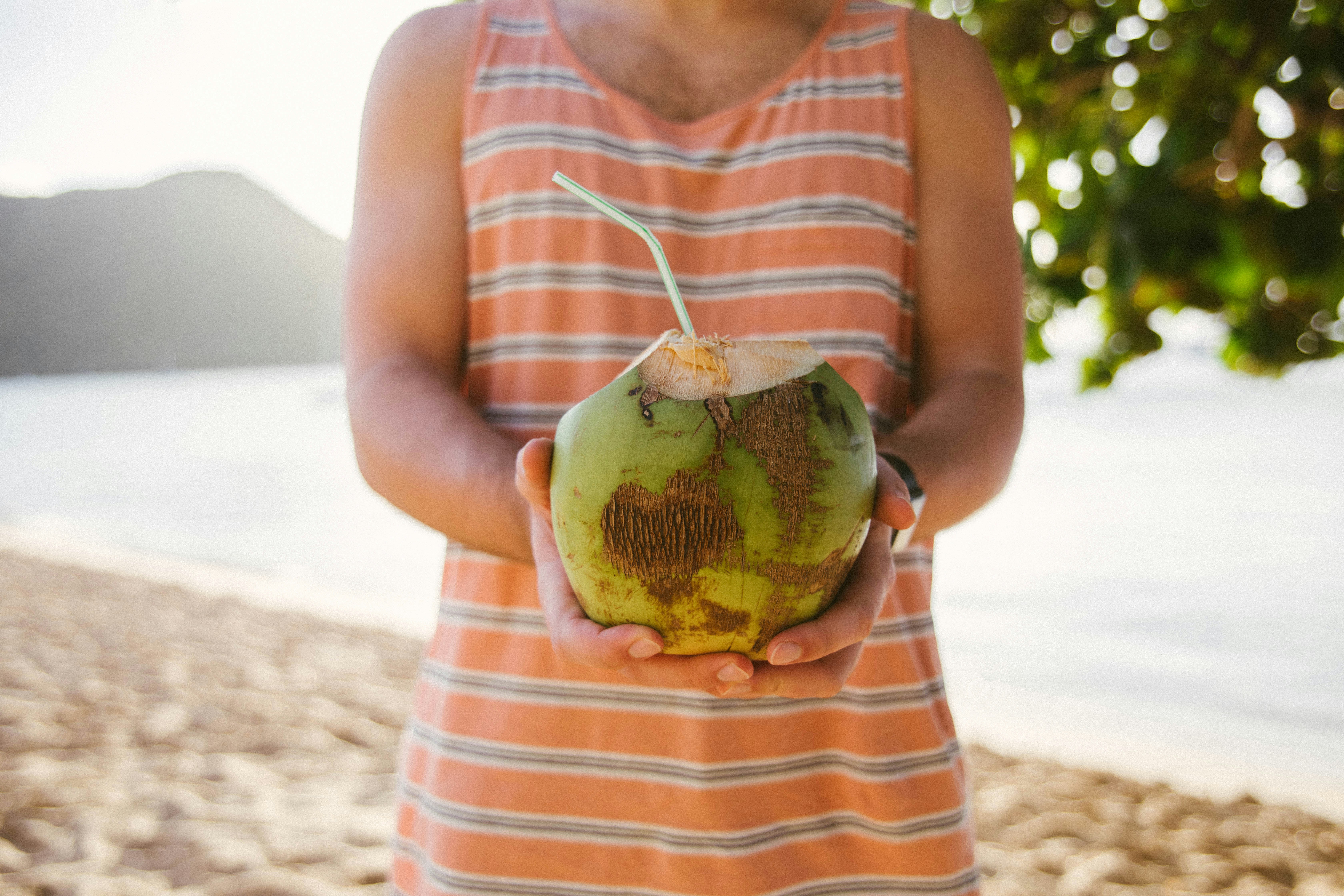 Tropical leaves and beach background