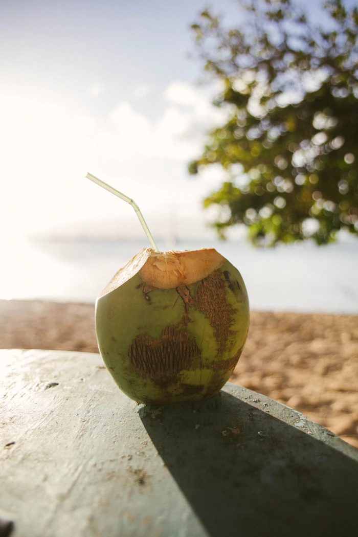 Fresh coconut water served with a straw