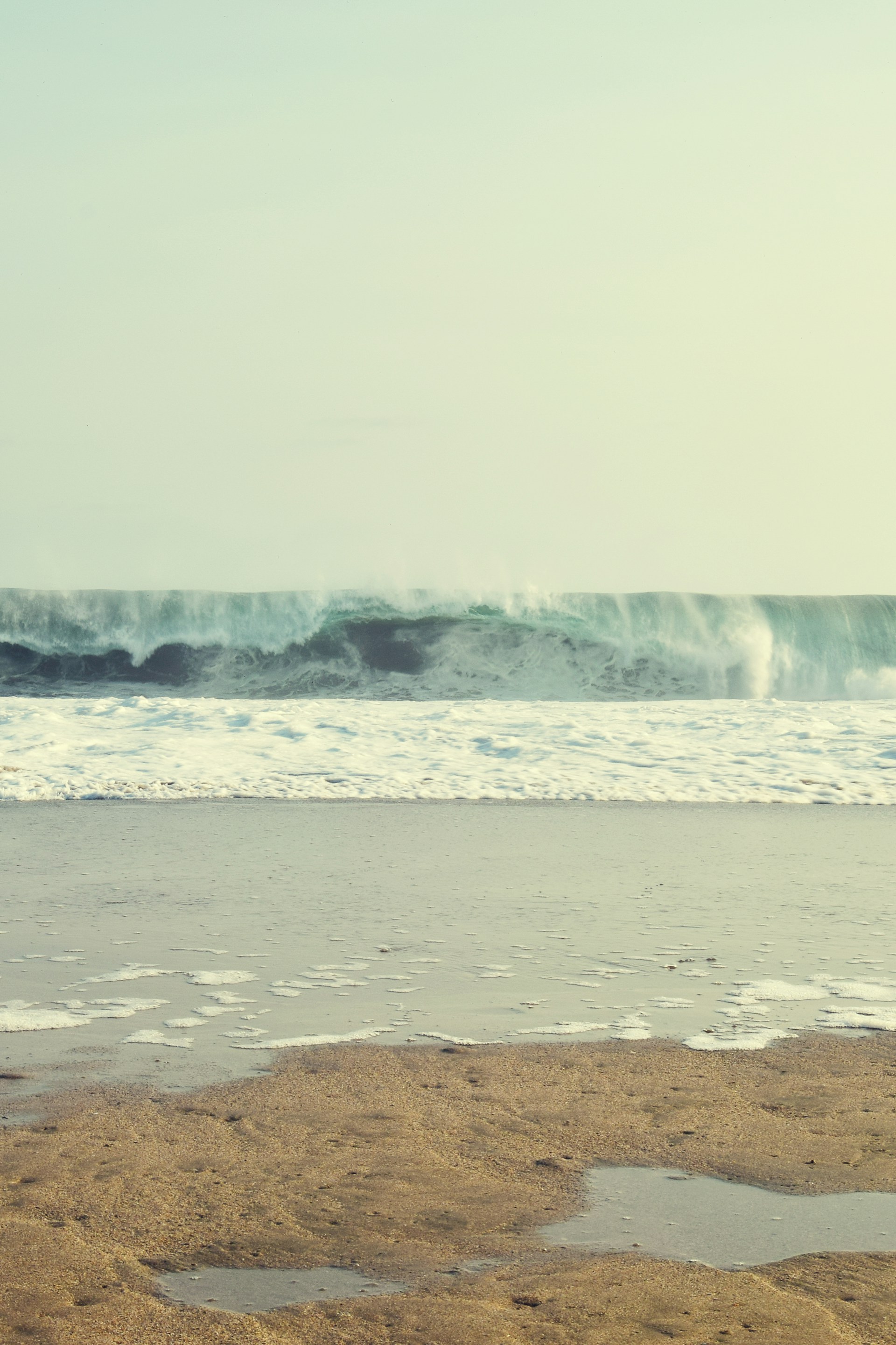water falls on brown sand