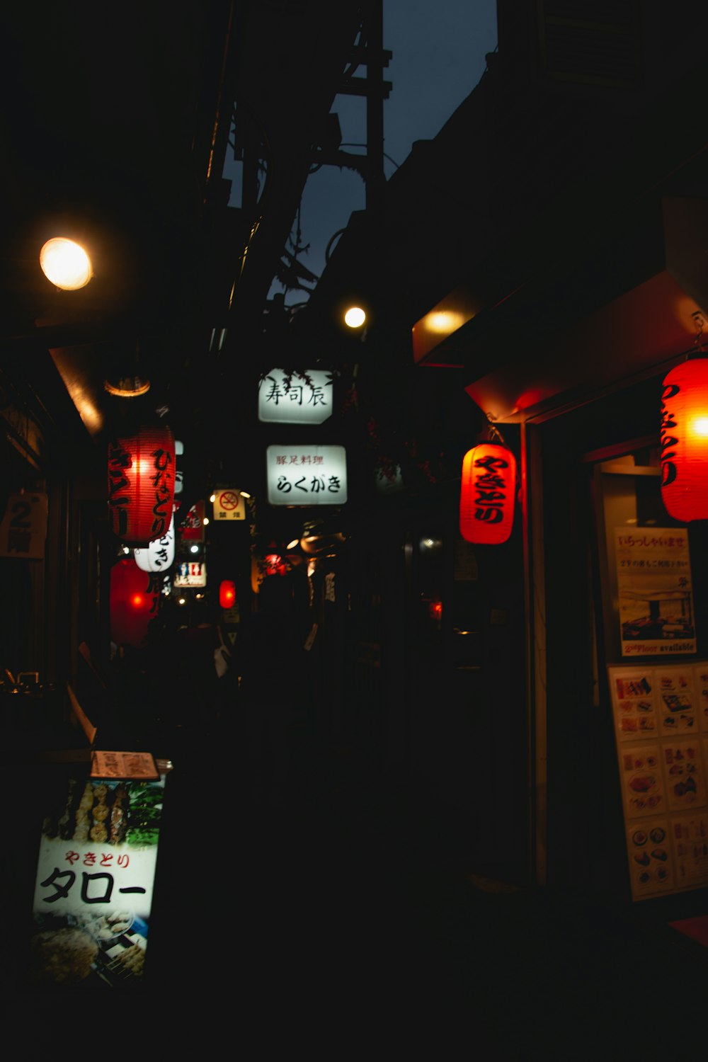 people walking on street during nighttime