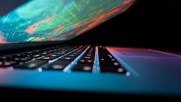 Close-up of a laptop screen displaying a tech review article with vibrant images.