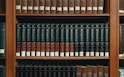 books on brown wooden shelf
