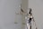 woman in dress holding sword figurine