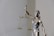 woman in dress holding sword figurine